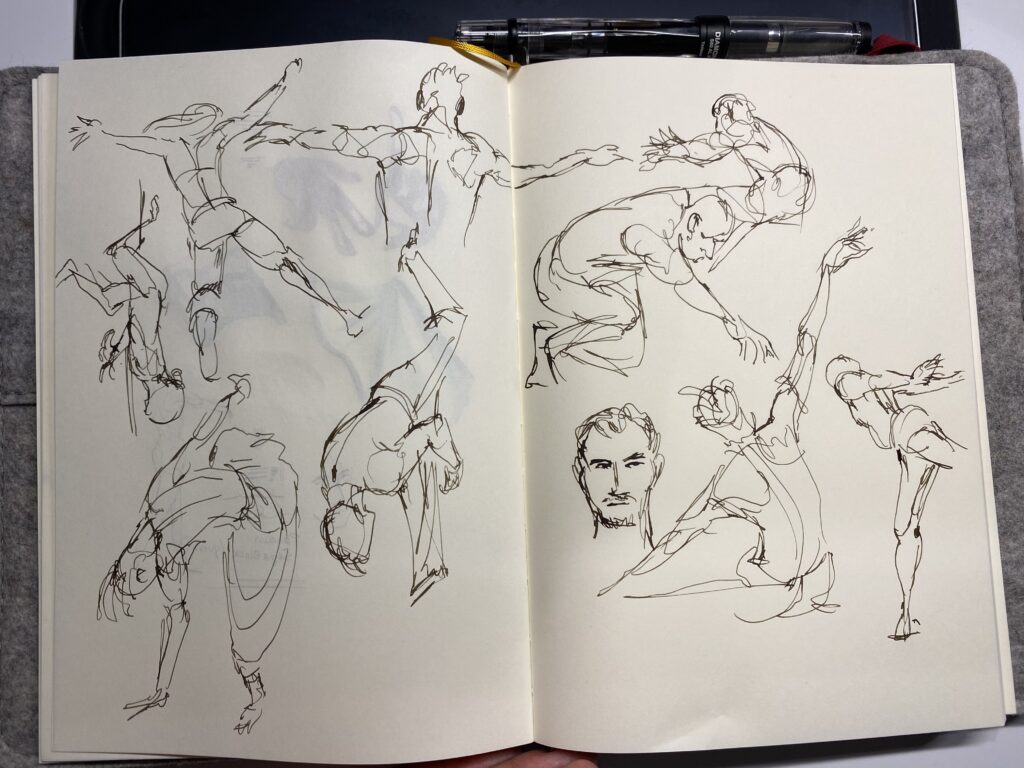sketchbook page of gesture drawings done with fountain pen
